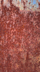 Rusty Grunge Texture: A close-up view of weathered metal reveals a symphony of textures and colors, evoking the passage of time. The surface is a mosaic of rust. 