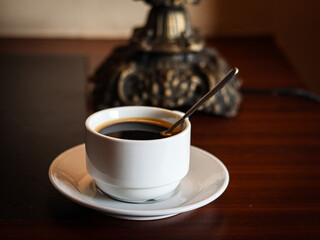 cup of coffee on wooden table