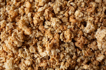 A top down view of a layer of granola cereal, as a background.