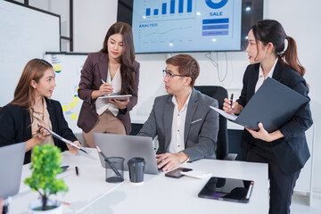 Group of Asian business people having a meeting in an office.