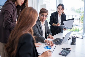 Group of Asian business people having a meeting in an office.
