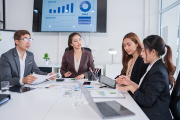 Group of Asian business people having a meeting in an office.