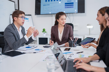 Group of Asian business people having a meeting in an office.