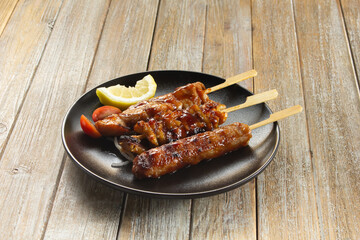A view of a plate of assorted yakitori.