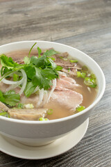 A view of a bowl of pho dac biet.