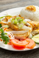 A view of a plate of tofu broken rice.