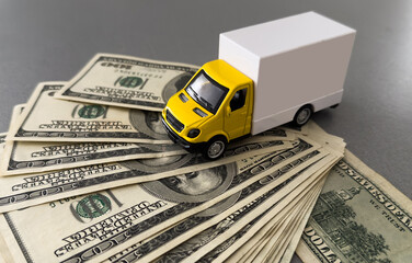Toy car truck with money isolated on white background