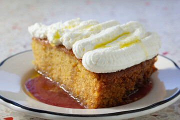 A closeup view of an olive oil cake slice.