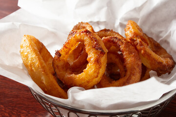 A view of a basket of onion rings.