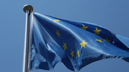 European Union flag waving on a sunny day. - Powered by Adobe