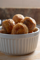 A closeup view of a small bowl of polenta roasted potatoes.