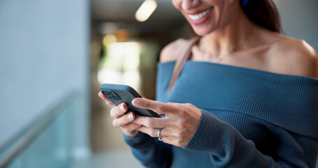 Business, smartphone and woman in office, hands and social media with online reading. Mature person, employee or professional in workplace, cellphone or chatting with connection or message to contact