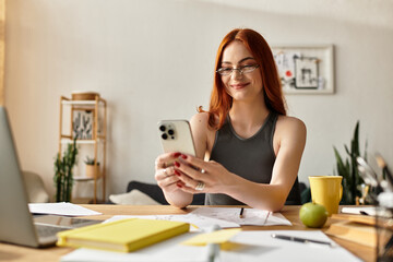Young beautiful woman enjoying her spare time while exploring her smartphone at home