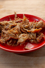 A view of a plate of crockpot BBQ chicken.