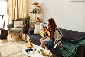Young woman enjoying a relaxing afternoon playing guitar in her cozy living room