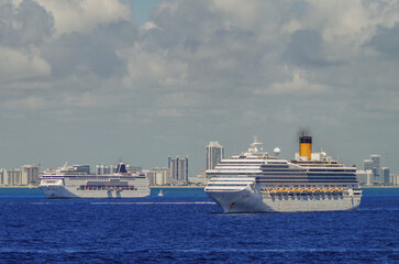 Modern cruiseships cruise ship liners Magica, Seaside, Armonia and Fortuna anchored offshore of...