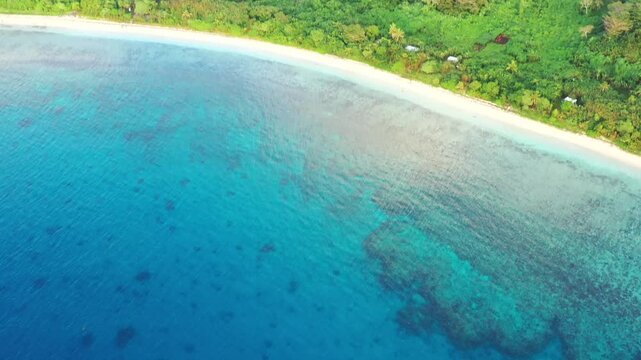 Shallow coral reefs beach and waters Tokoriki island in Fiji &ndash; tourism holiday resort aerial view.
