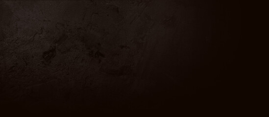Black cement texture with gradient color with soft light. Wide and large backdrop.