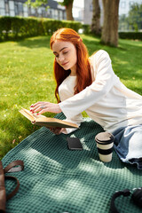 Enjoying a peaceful afternoon with a book in a sunlit park while sipping coffee