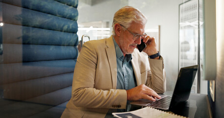 Mature, businessman and laptop with phone call in office booth for financial advice or discussion....