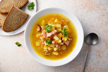 Traditional pea soup with smoked bacon