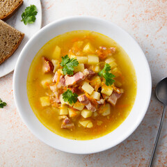 Traditional pea soup with smoked bacon