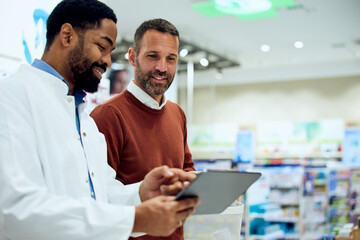 Two Professionals Collaborating and Using a Tablet in a Modern Pharmacy