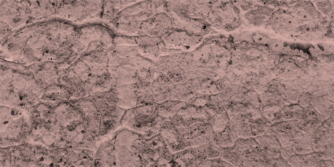 Texture of a cracked concrete surface depicting detailed cracks and imperfections with a dusty rose color aesthetic perfect for backgrounds