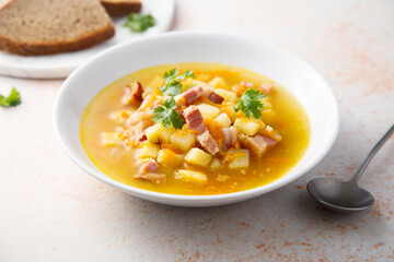 Traditional pea soup with smoked bacon