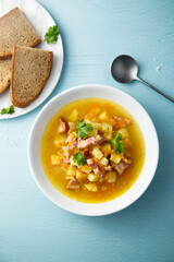 Traditional pea soup with smoked bacon
