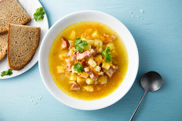 Traditional pea soup with smoked bacon