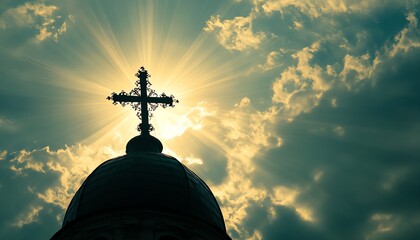 A cross silhouetted against a dramatic sky.