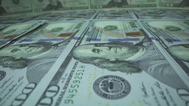 Cash money banknotes. Macro 100 american dollar bills counting. Franklin's face texture. Finance, investment concept. Close-up shot. Currency exchange of one hundred USD. Rich business economy of USA