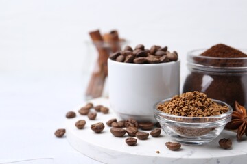 Different types of instant coffee, beans and spices on light textured table, closeup. Space for text