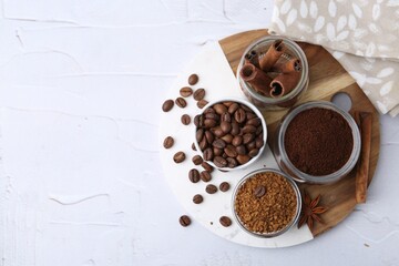 Different types of instant coffee, beans and spices on light textured table, top view. Space for text