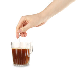 Woman stirring tasty instant coffee with spoon on white background, closeup