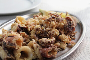 Calamari a la Roman Galician style, fried in olive oil and seasoned with a little coarse salt.