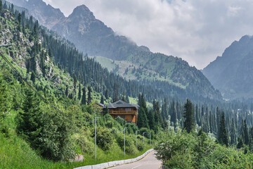 Mountain lodge by pine forest in scenic Small Almaty Gorge, Zailisky Alatau range, Kazakhstan