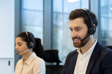 Friendly customer service representatives wearing headsets in a modern office setting. A diverse team providing support and assistance.