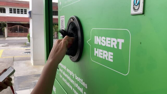 Individuals return plastic bottles in Reverse Vending Machine at Petrol Station &mdash; Smart Recycling in Southeast Asia