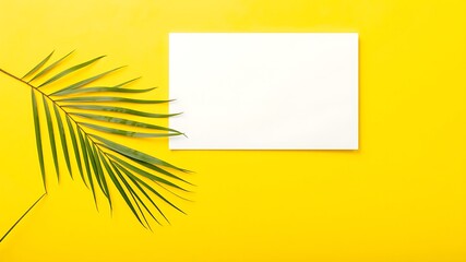 A vibrant yellow background showcases a fresh green palm frond and a crisp white rectangular paper for creative design