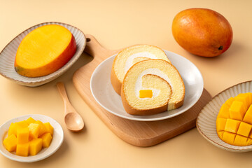 Delicious mango cream Swiss roll cake on plate