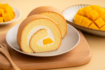 Delicious mango cream Swiss roll cake on plate