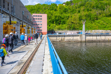 Visitors are seen walking near the Orlik Dam and Hydroelectric Power Station in Czechia. The...