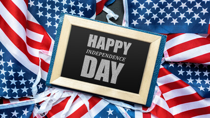 Festive celebration of Independence Day with American flags and a cheerful greeting displayed on a...