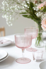 Delicate pink glassware creates sophisticated ambiance for special dining occasions.