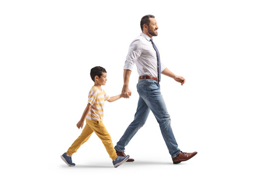 Father and a son walking together and holding hands