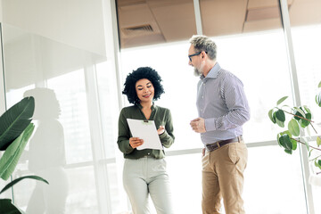 Professional teamwork displaying collaboration in a modern office environment with diverse...