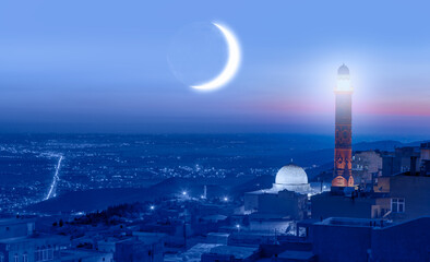 Ramadan Concept with Crescent -  Ulu mosque and cannon at twilight blue hour - Amazing view of...