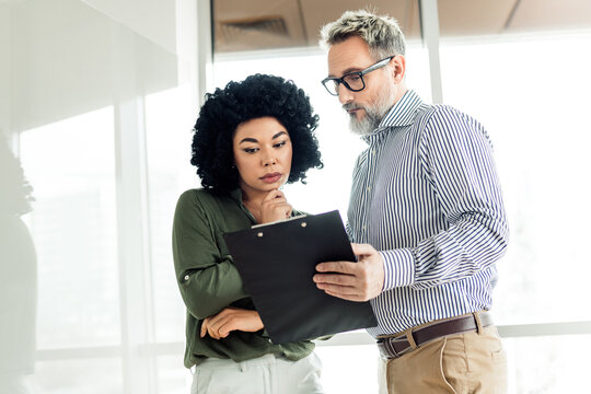 Professional teamwork of business colleagues collaborating on a project in a modern office space